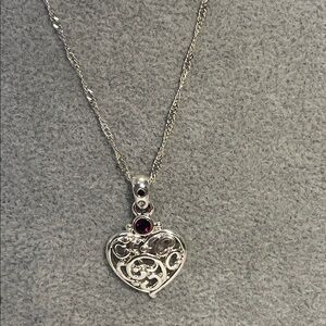 Elegant Silver Heart Pendant Necklace with garnet and twirled silver chain